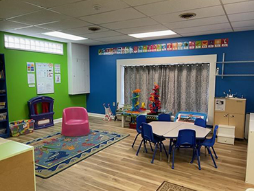 Kids Academy Play Area With Tables And Chairs